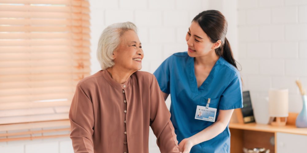 nurse helping elder patient