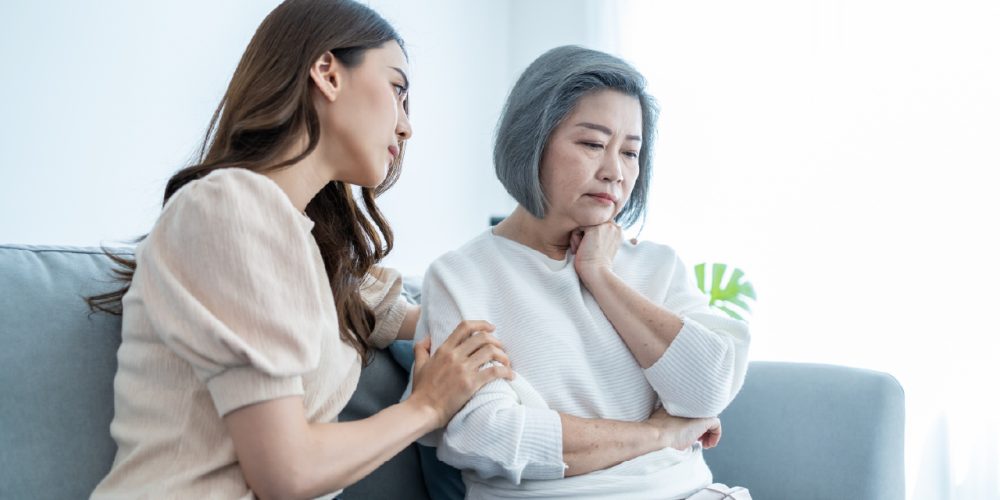 woman is consoled during her breast cancer journey