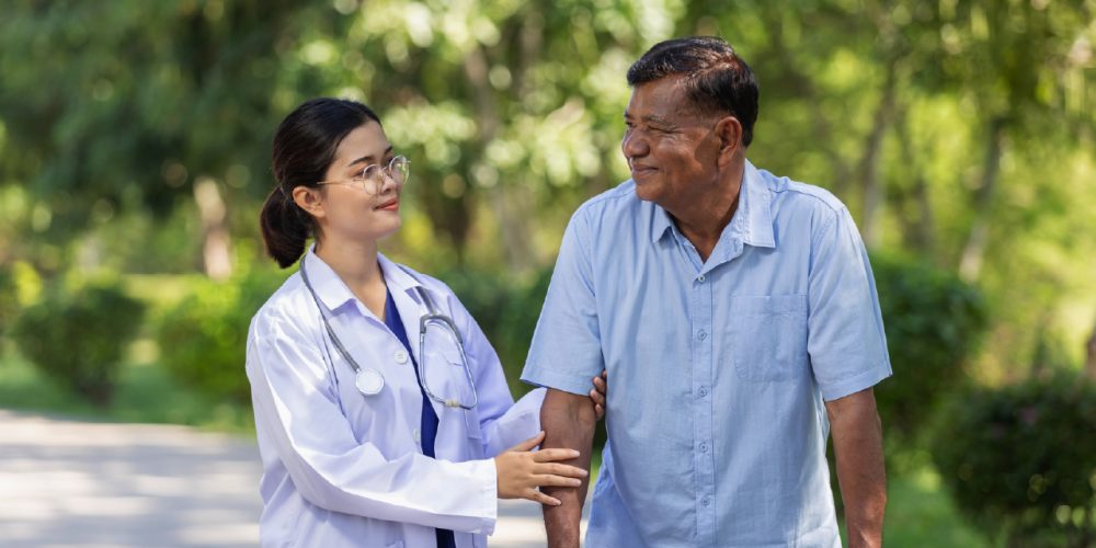 patient on a walk outside receiving palliative care from a doctor