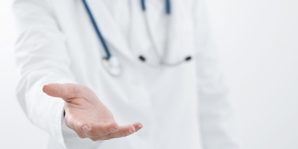 a doctor with an outstretched hand